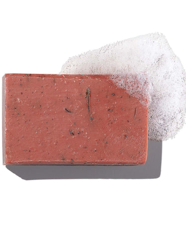 Antü Restoring Soap with lather on white background.