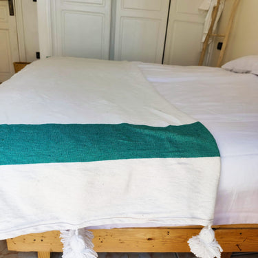Green and white single stripe pompom blanket
